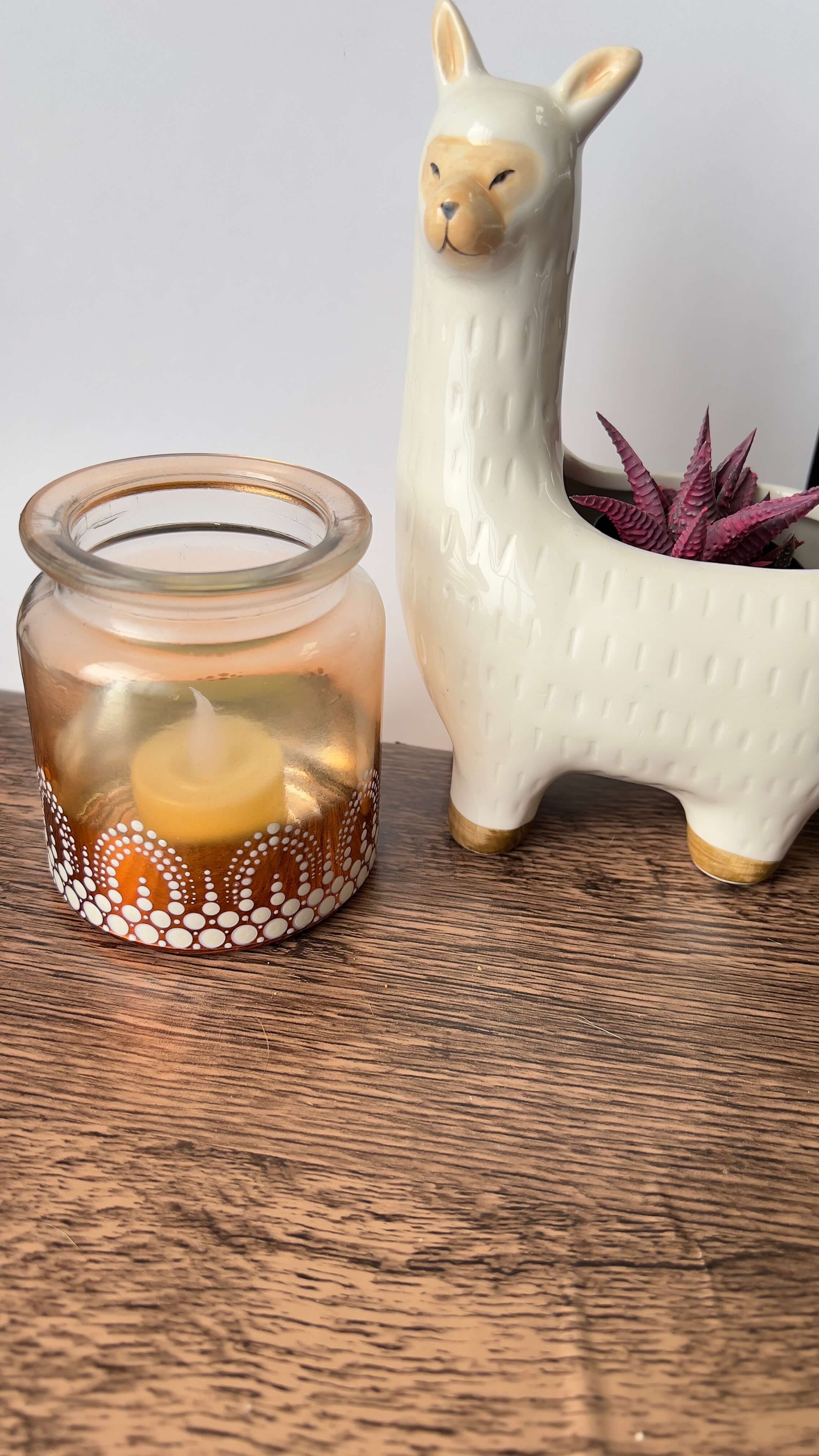 Copper votive with white dot mandala design